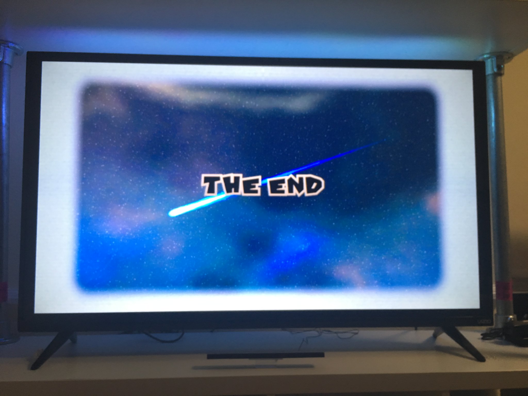 A photo of a TV showing the end game screen.