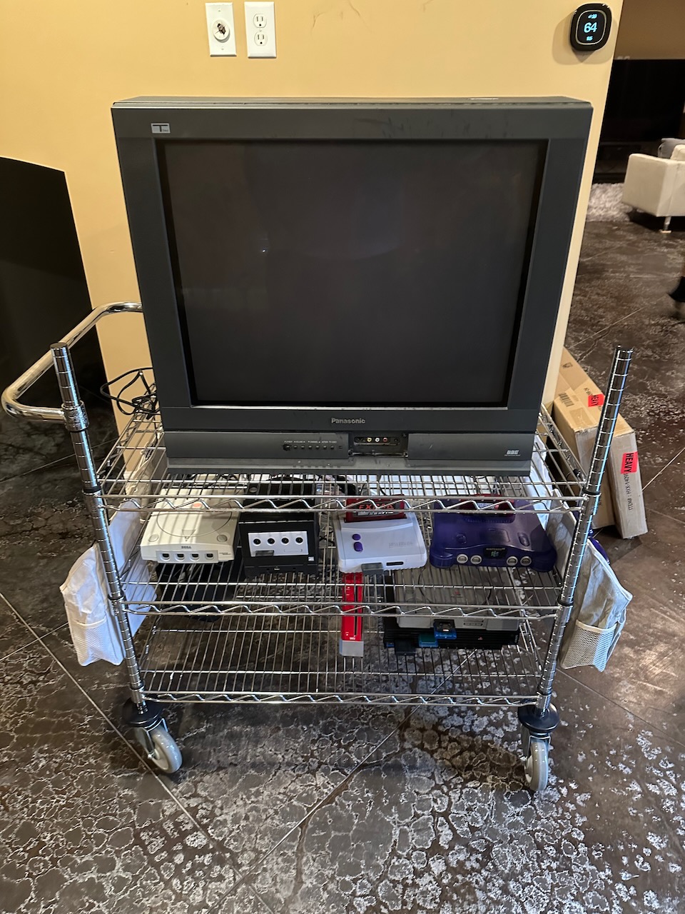 The same cart but with a 27" Panasonic CRT TV and several retro consoles